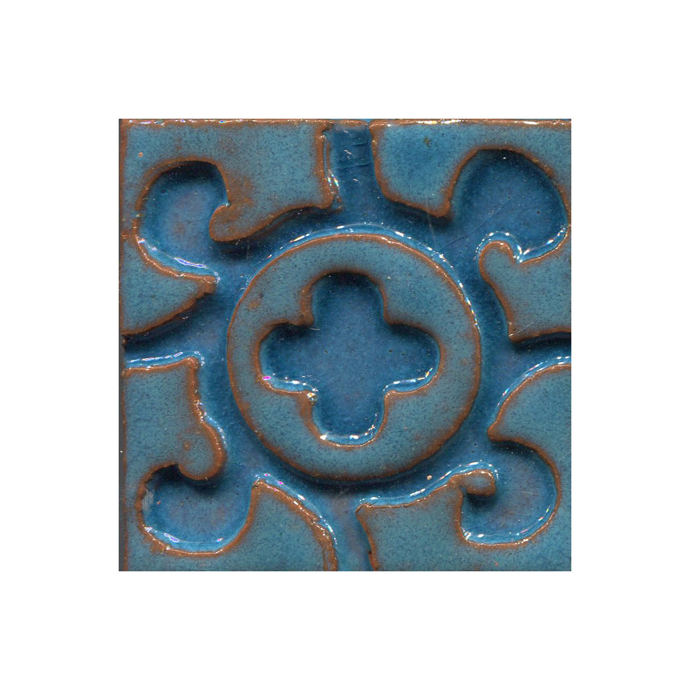 A collection of tiles featuring a stamped clover pattern in Robins egg Blue