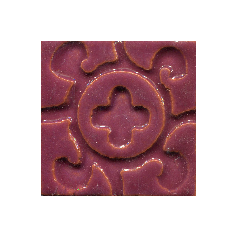 A collection of tiles featuring a stamped clover pattern in sugar plum pink