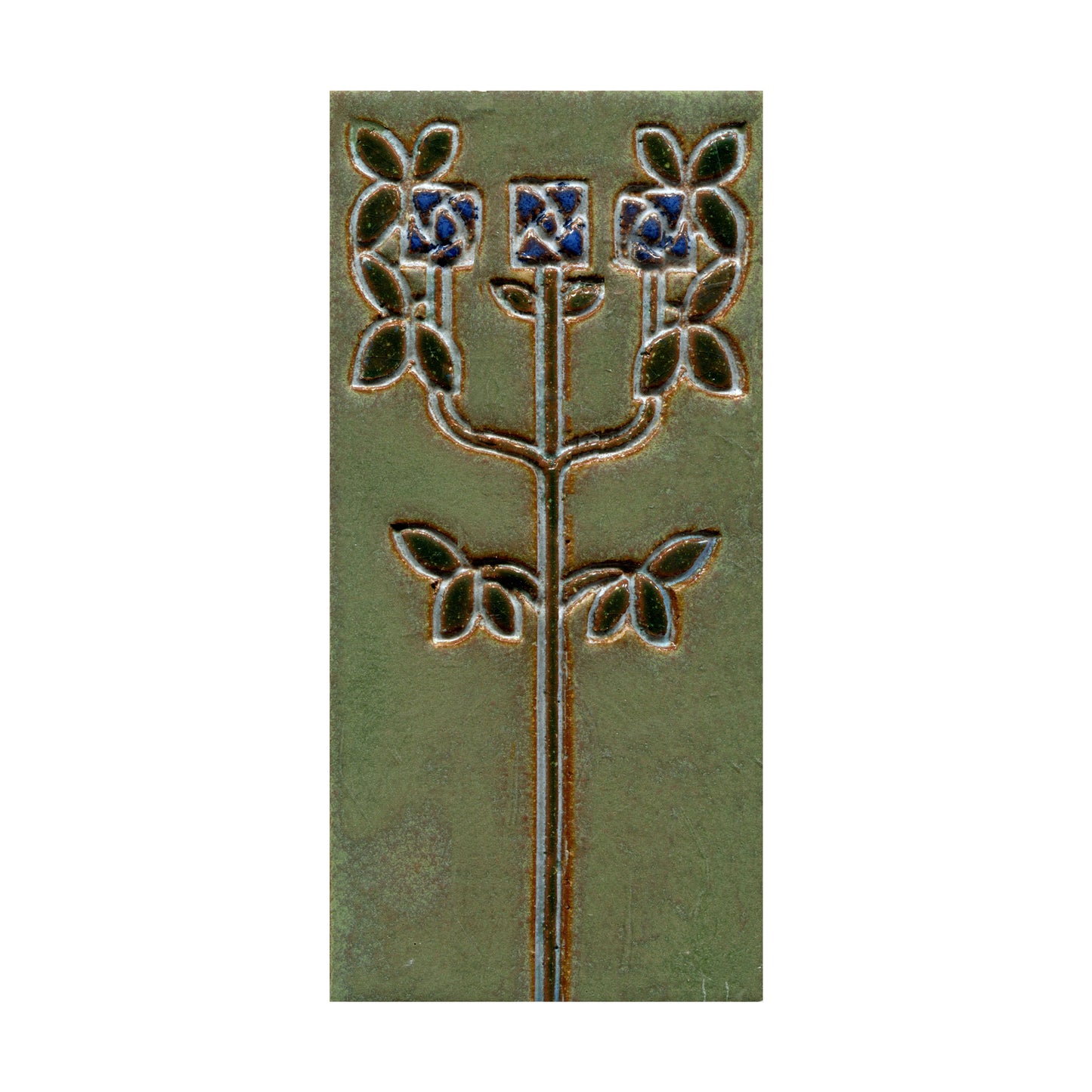 Decorative tile with floral design on a green background