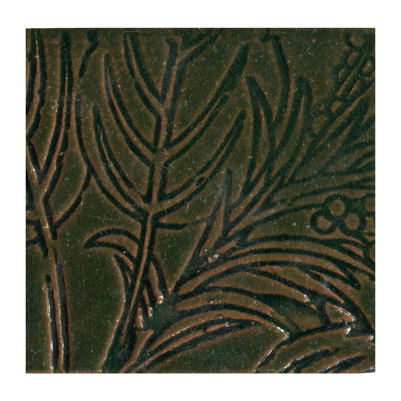 Decorative tile with leaf pattern on a dark green background