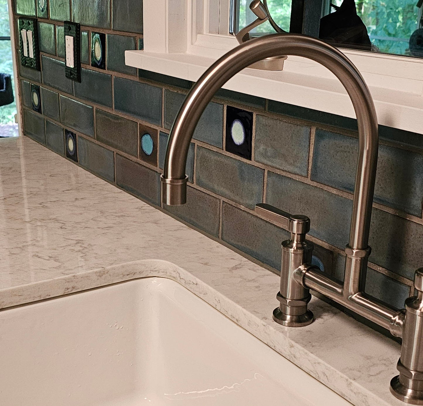 A cool grey color and a glossy opaque, showing medium variation with occasional blue-grey flashes.
