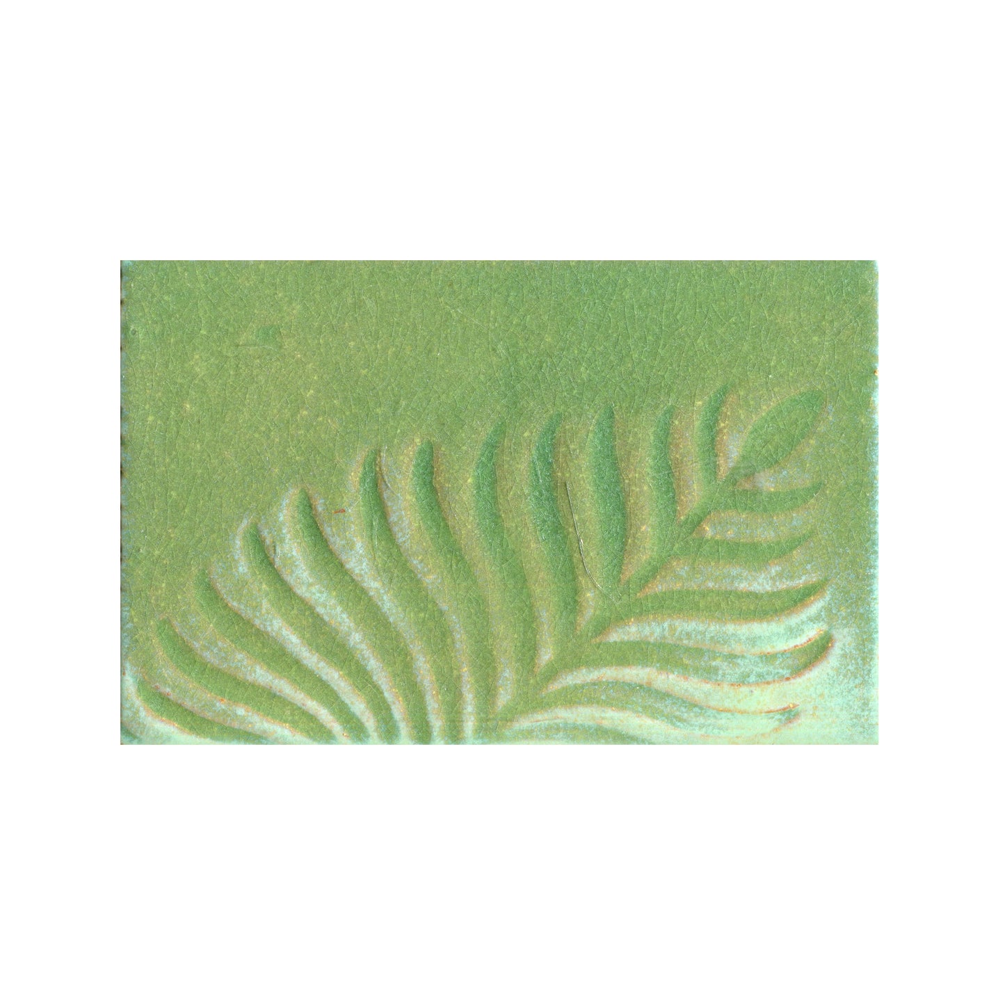 Green stamped tile with a leaf pattern