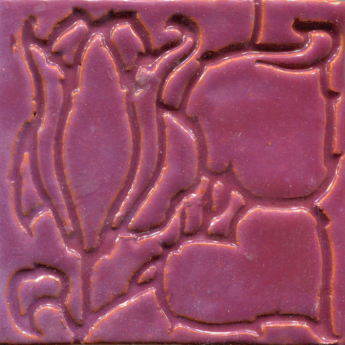 A collection of tiles featuring a stamped floral pattern with tulip designs in pink