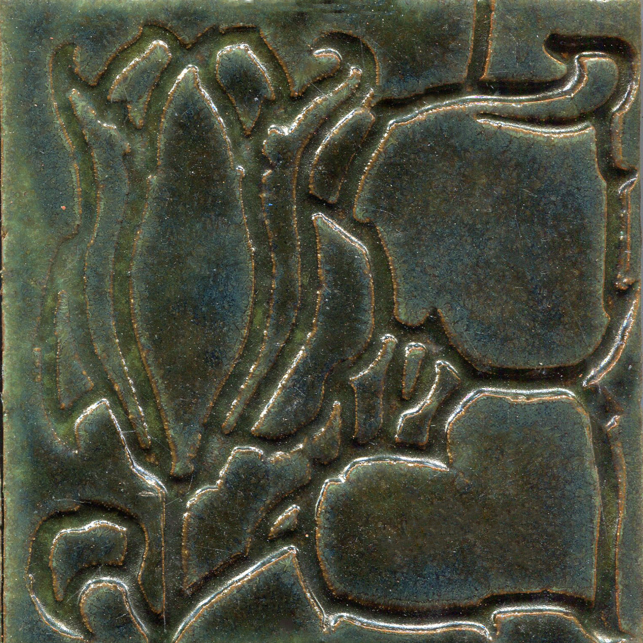 A collection of tiles featuring a stamped floral pattern with tulip designs in dark green color