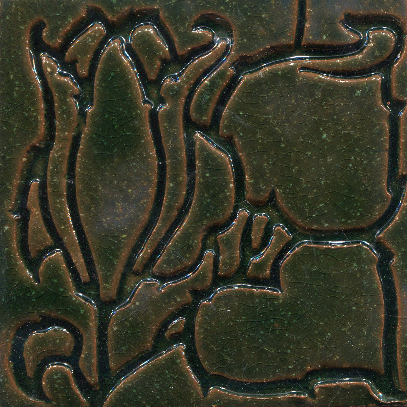 A collection of tiles featuring a stamped floral pattern with tulip designs in green color