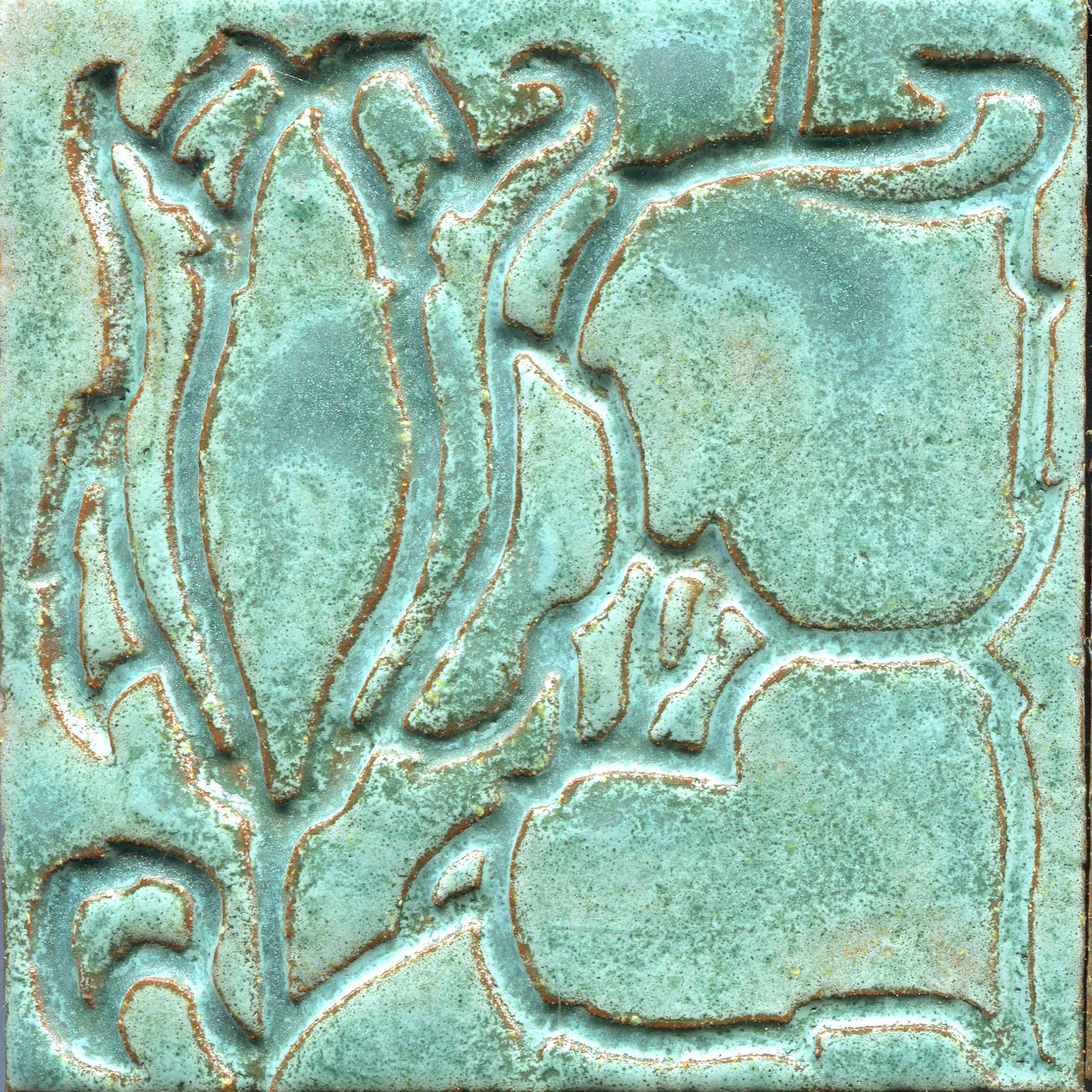 A collection of tiles featuring a stamped floral pattern with tulip designs in aqua green colors