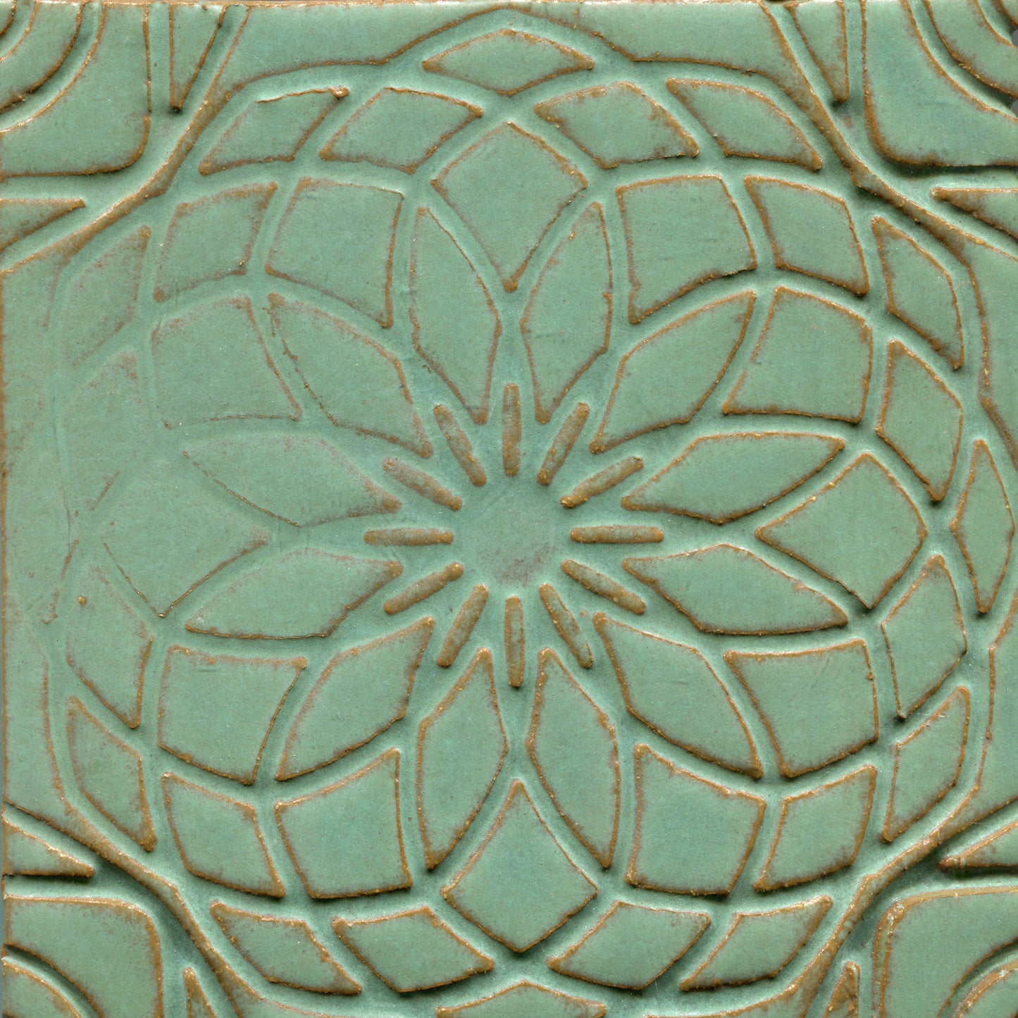Matte Green stamped tile with a geometric floral pattern.