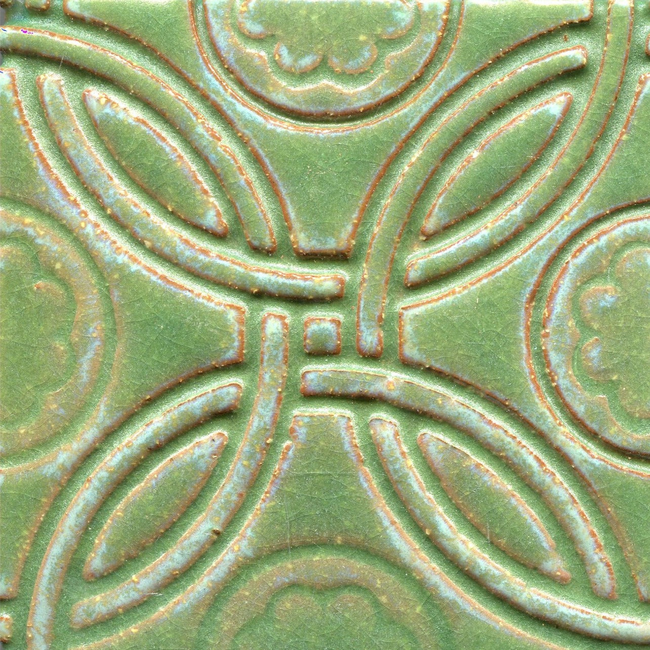 A Celtic inspired geometric pattern on stamped tiles in green