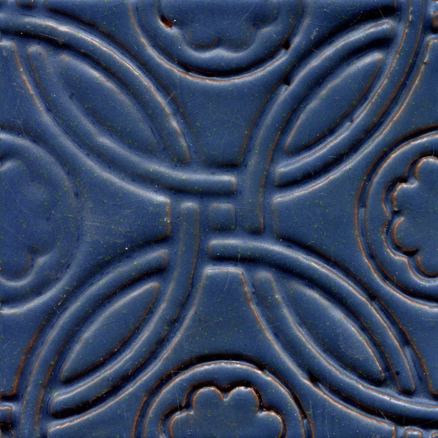 A Celtic inspired geometric pattern on stamped tiles in blueberry