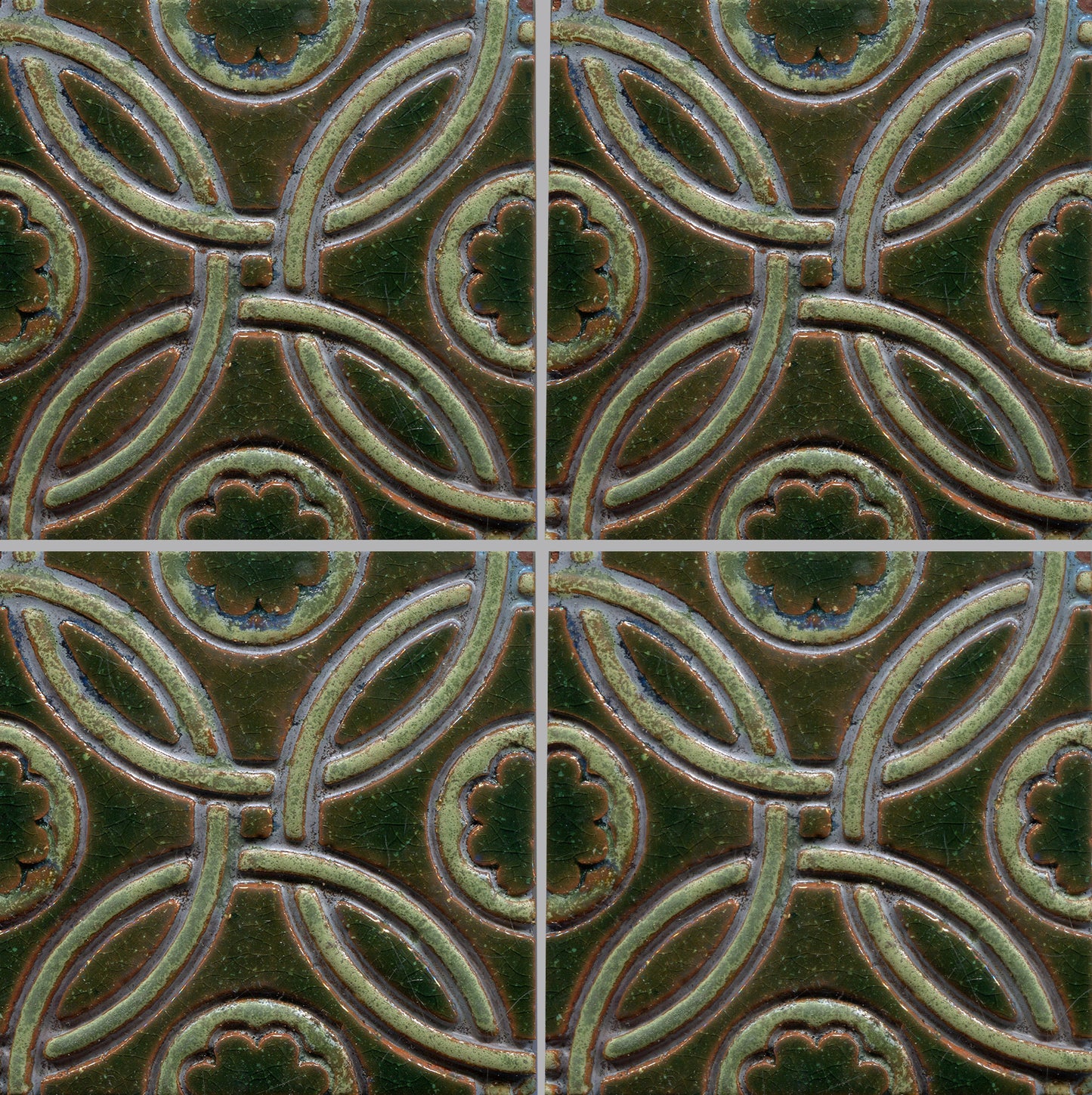 A Celtic inspired geometric pattern on stamped tiles in various colors.