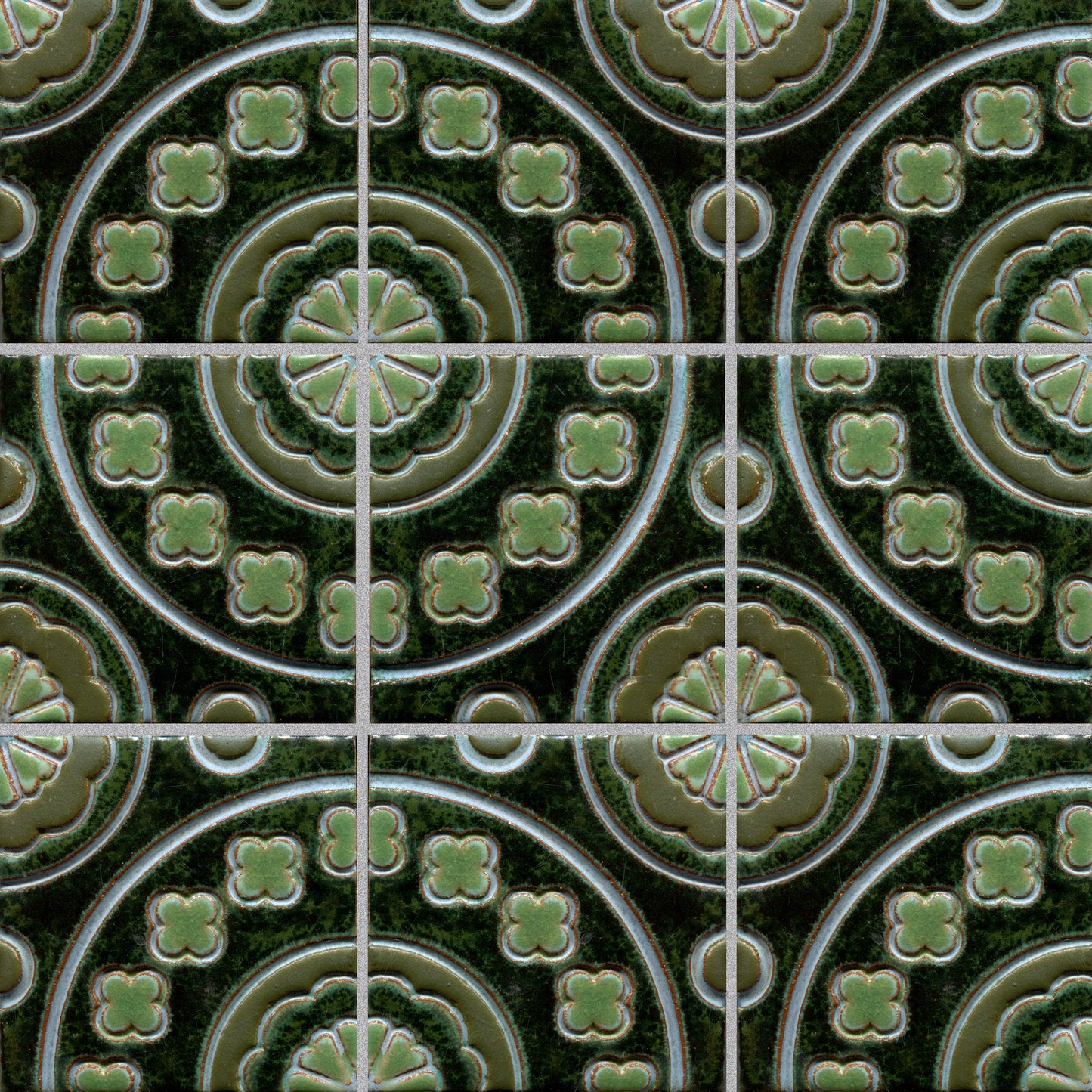 Green floral patterned tile, which is part of a set of connectable accent tiles.