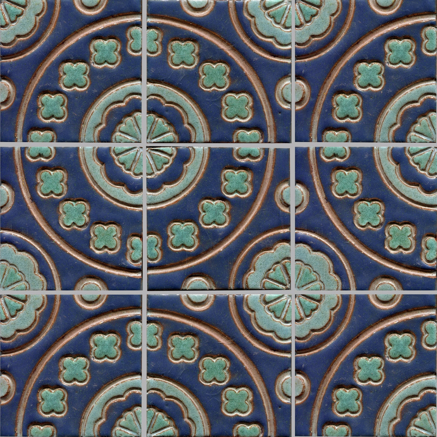 Blue and green floral patterned tile, which is part of a set of connectable accent tiles.