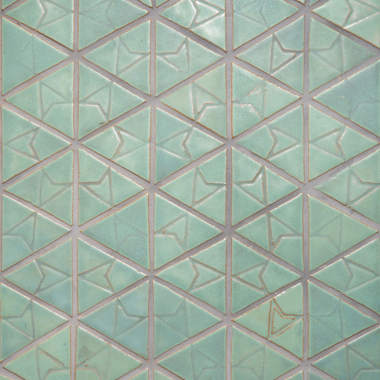Laurel Triangle tiles. Light relief stamp creates three designs in the pattern