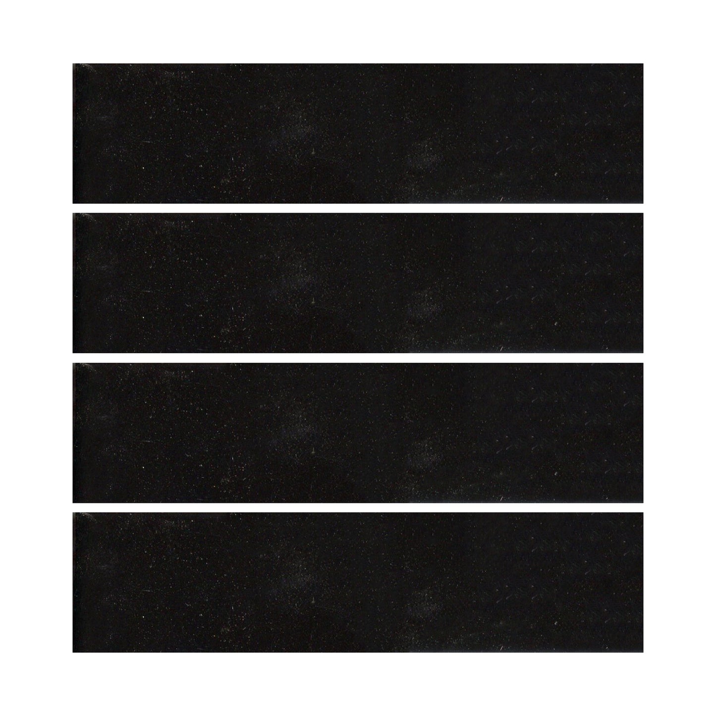 Black ceramic tiles showing a gloss black color with hints of blue.
