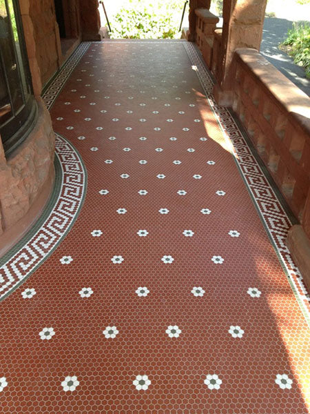Red hexagon and white floret floor for porch