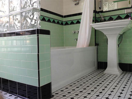 Black base cove and trim in Midcentury bathroom