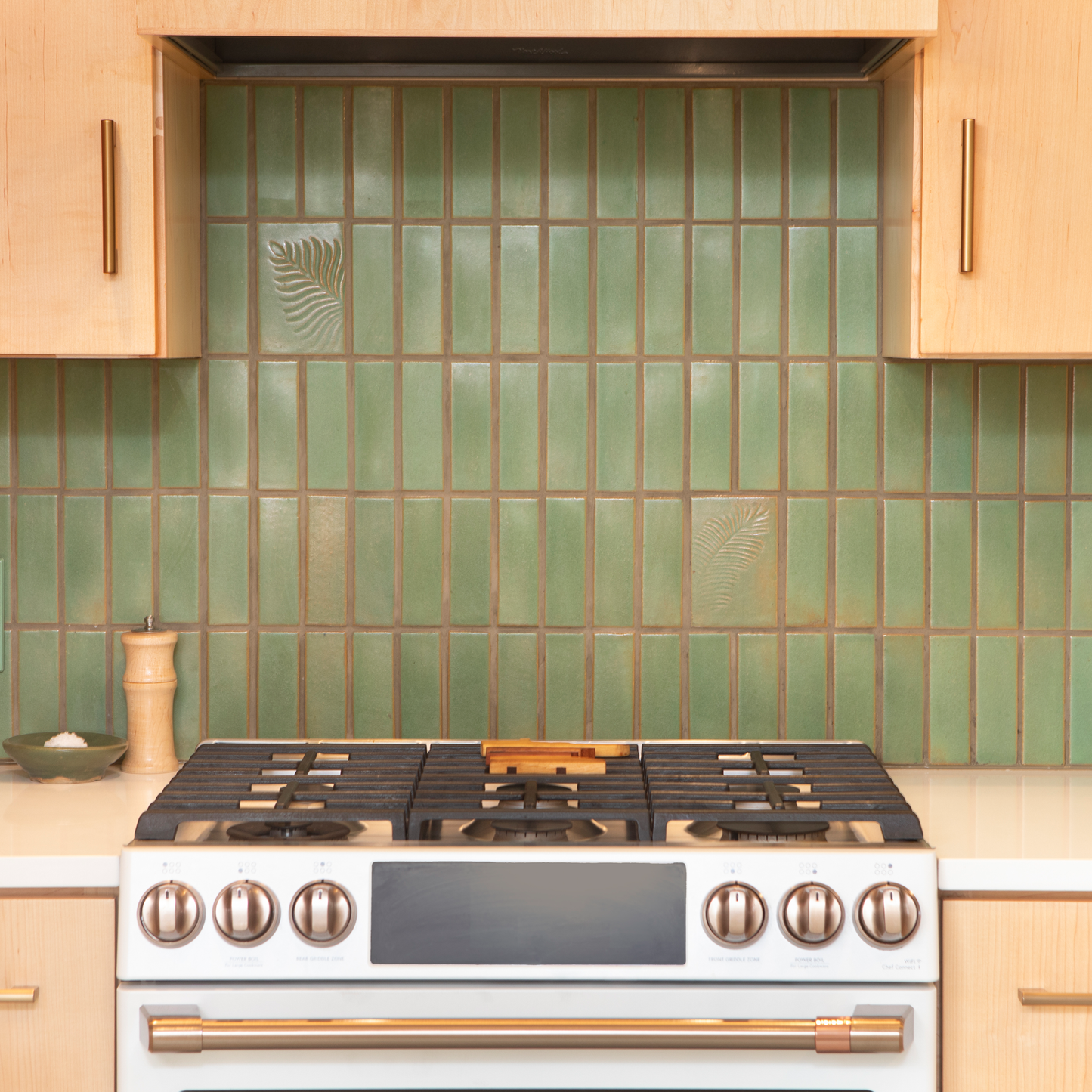 green kitchen backsplash with fern tile