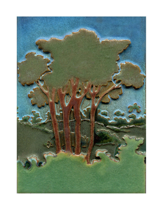 Decorative tile with tree design on a blue and green background