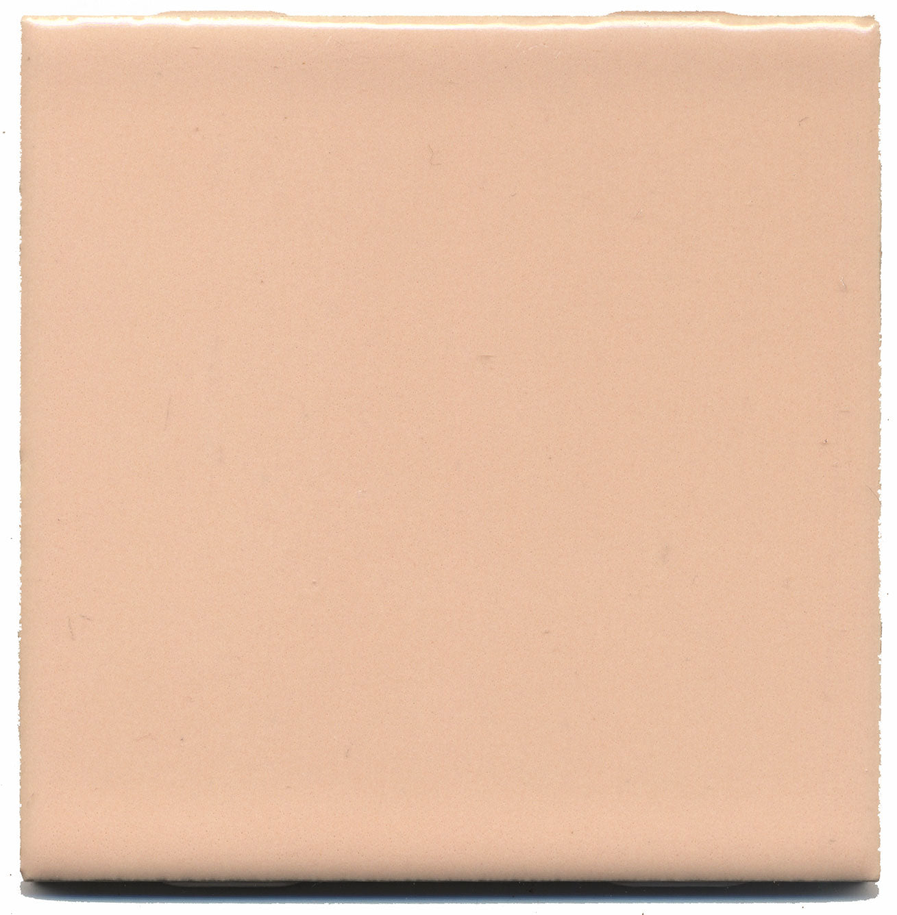 A single square peach-colored ceramic tile with a gloss satin finish.