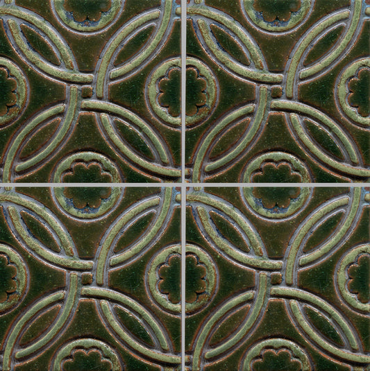 A Celtic inspired geometric pattern on stamped tiles in various colors.