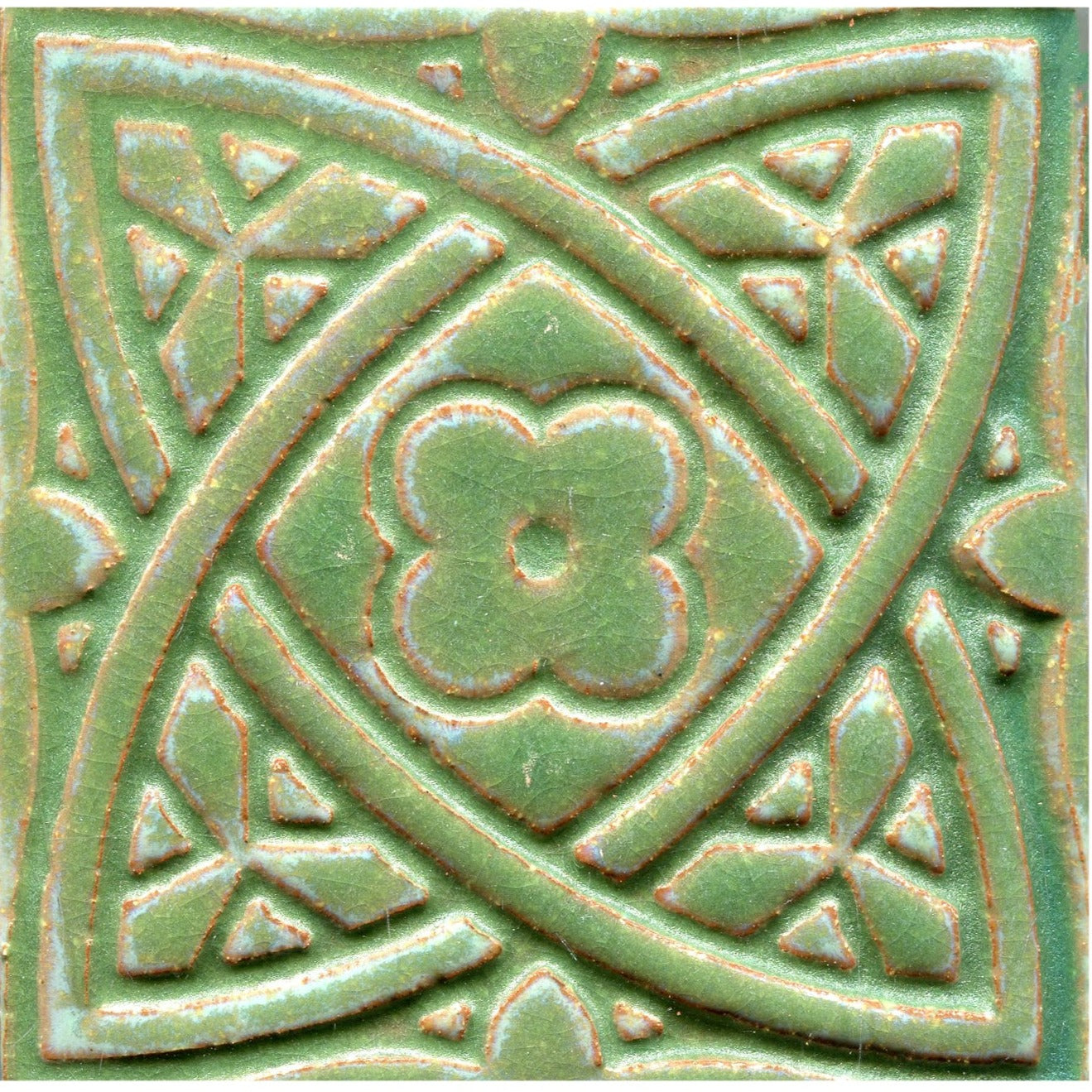 Green stamped tiles with a Celtic geometric pattern.