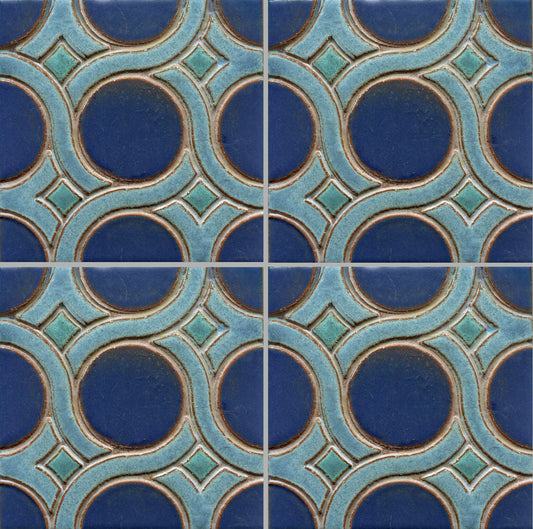 A pattern of woven knots on stamped tiles, with blue and green colors creating a geometric design.