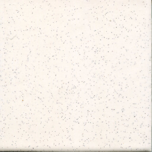A white ceramic tile with speckles of black pepper, part of the Mid-Century Series.